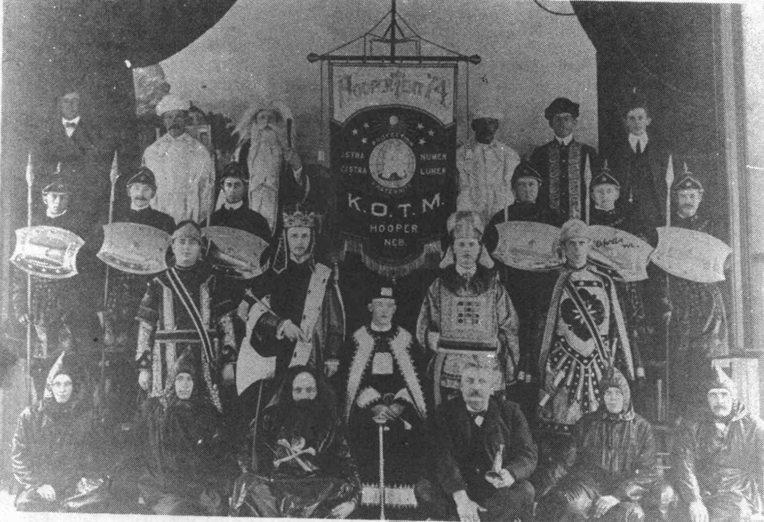 Hooper lodge group with a banner reading K.O.T.M., Hooper, Nebraska