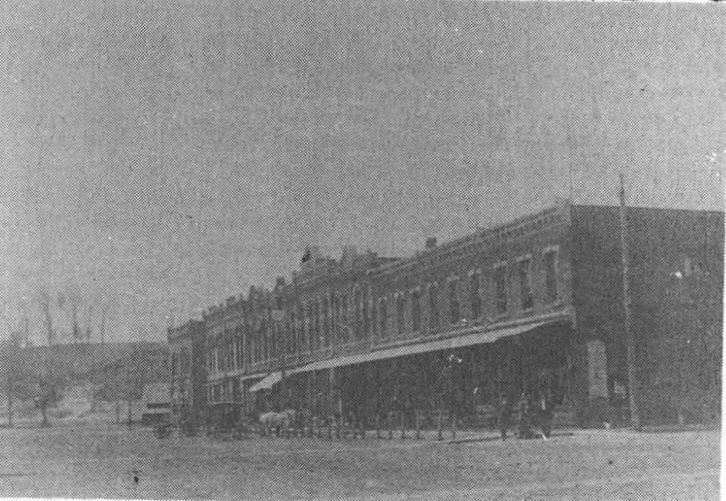 An undated historic photograph of the west side of Hooper’s Main Street; town context, not a view of Hooper Cemetery.