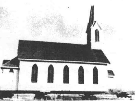 St. John’s church raised above the ground during its mid-1950s move into Hooper.