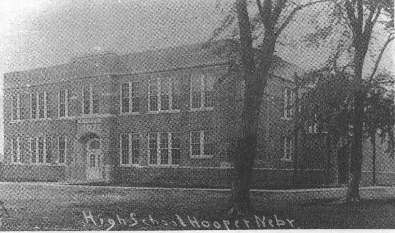 An undated historical photograph of the brick Hooper High School building, with its name written along the bottom.