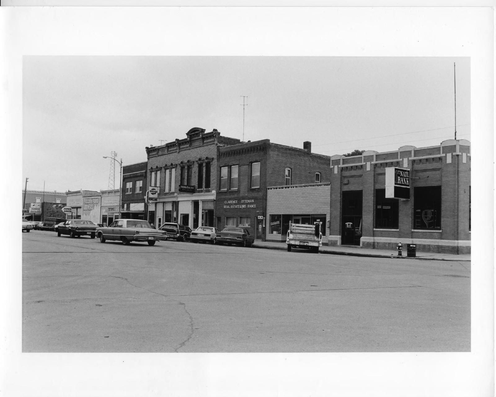 Historic view of the east side of Hooper’s Main Street, including the 1899 double storefront associated with Hoffman’s bakery.