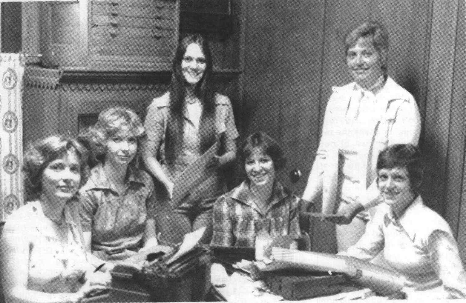Mrs. Jaycees members working on the 1976 centennial book