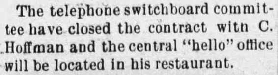 Short newspaper notice confirming C. Hoffman’s switchboard contract and restaurant office.
