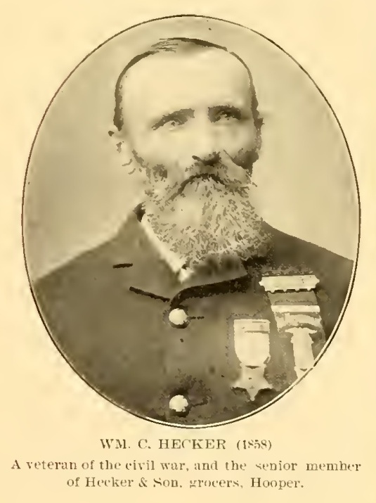 William C. Hecker, shown with the original caption identifying Hecker and Son, grocers in Hooper.
