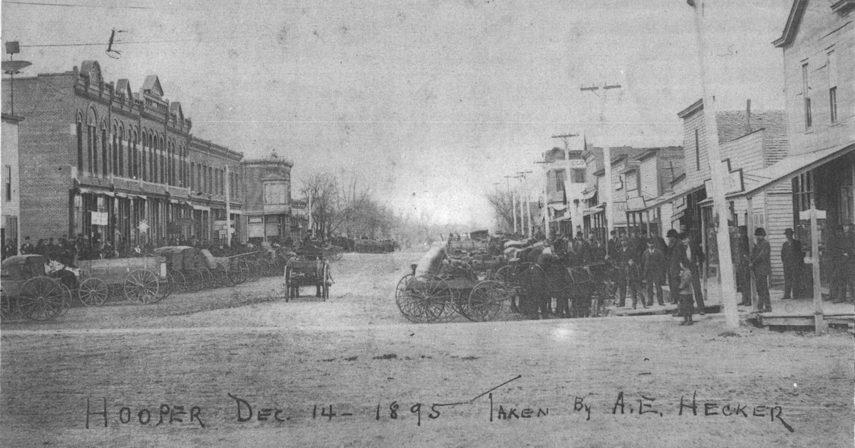 Hooper, Nebraska Main Street on December 14, 1895, with horse-drawn wagons and early storefronts